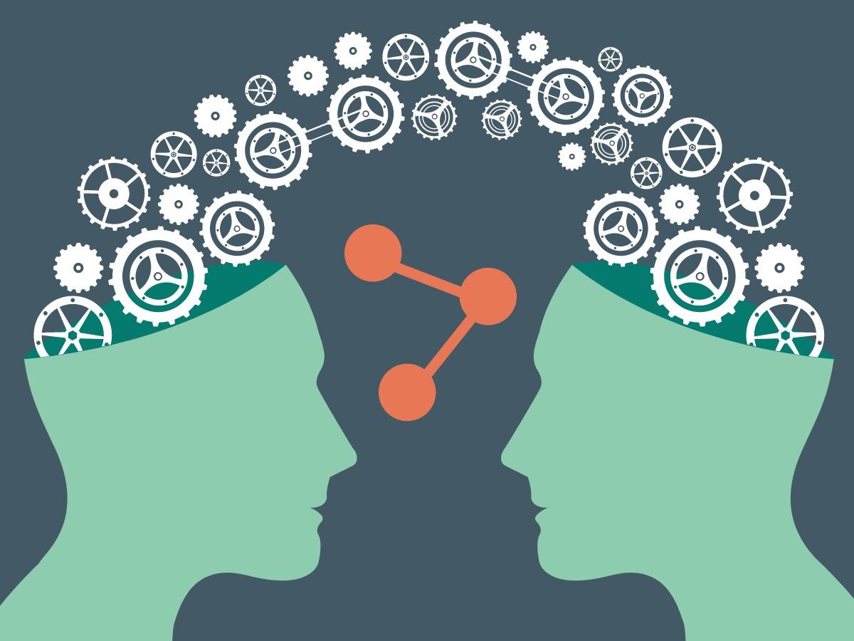 Concept art of two people sharing ideas and working together - Ten types of social media and how your business can benefit from them - Image