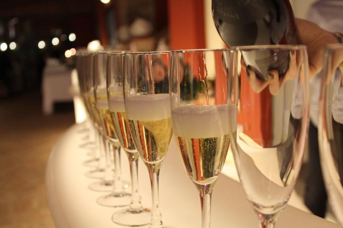 Image of a bartender pouring champagne into glasses - 80 Creative and inspiring engagement party ideas - Image